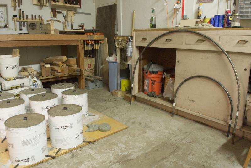 Large arcs next to concrete bases.