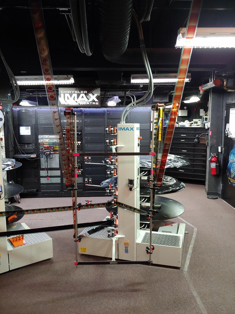 IMAX film reopening trials with projectionist.